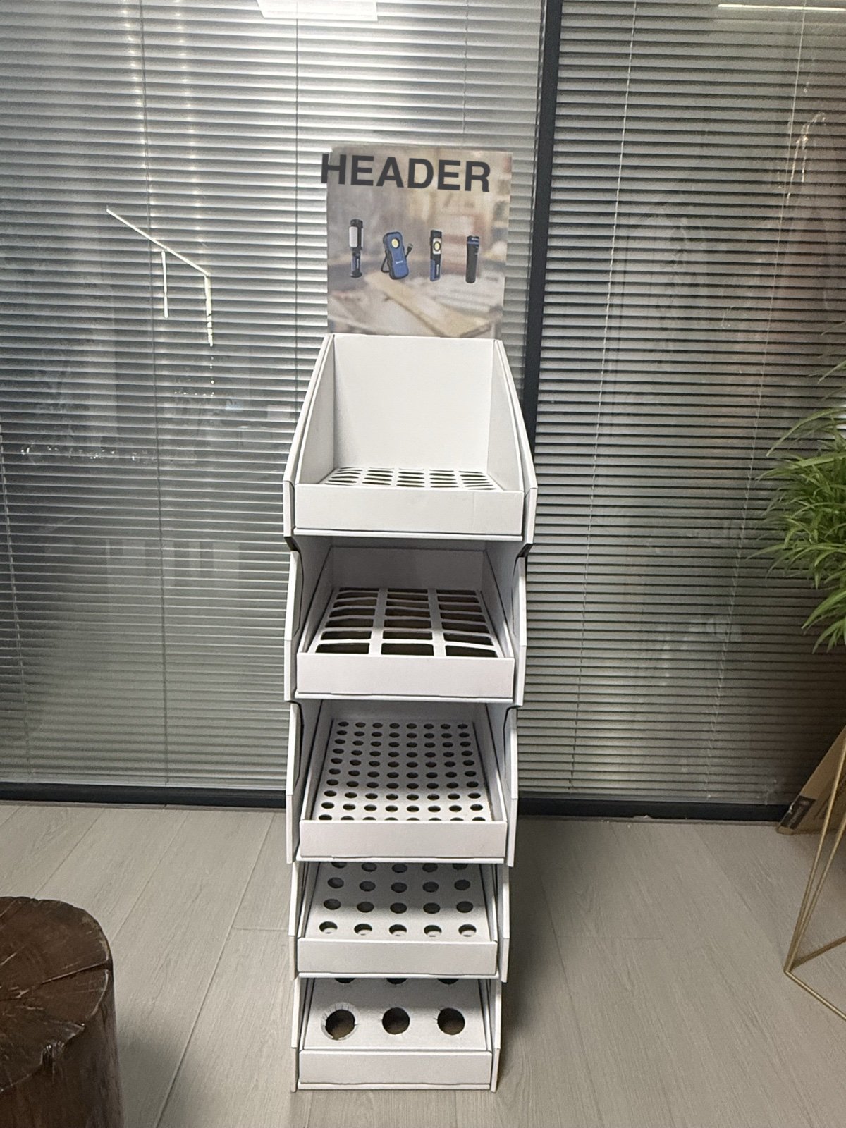 Front close-up of stepped trays with die-cut insert holes