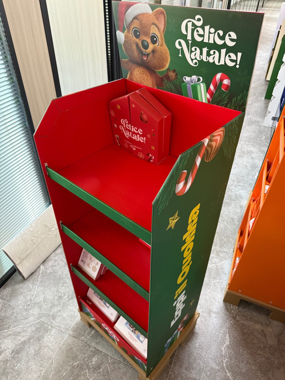 Top shelf of Christmas pop-up floor display stand