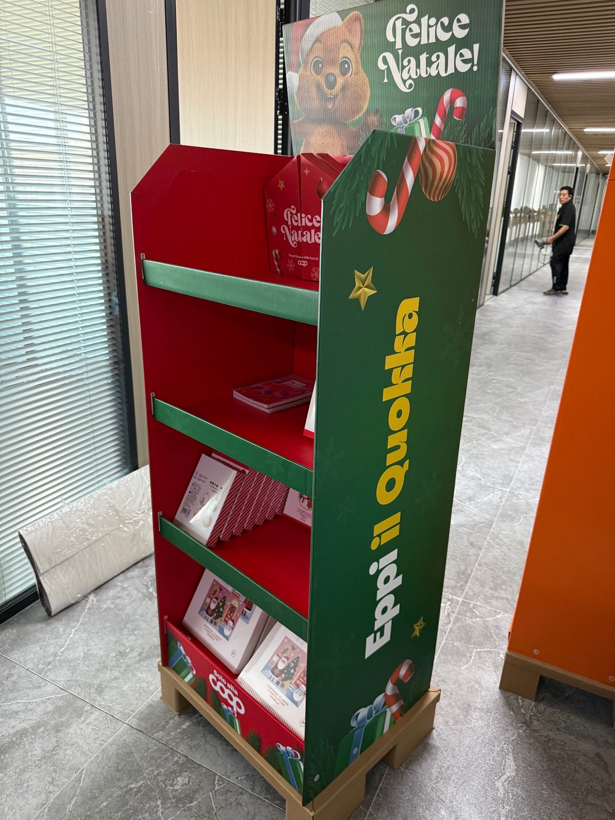Side view of Christmas corrugated floor display stand showing printed side panel