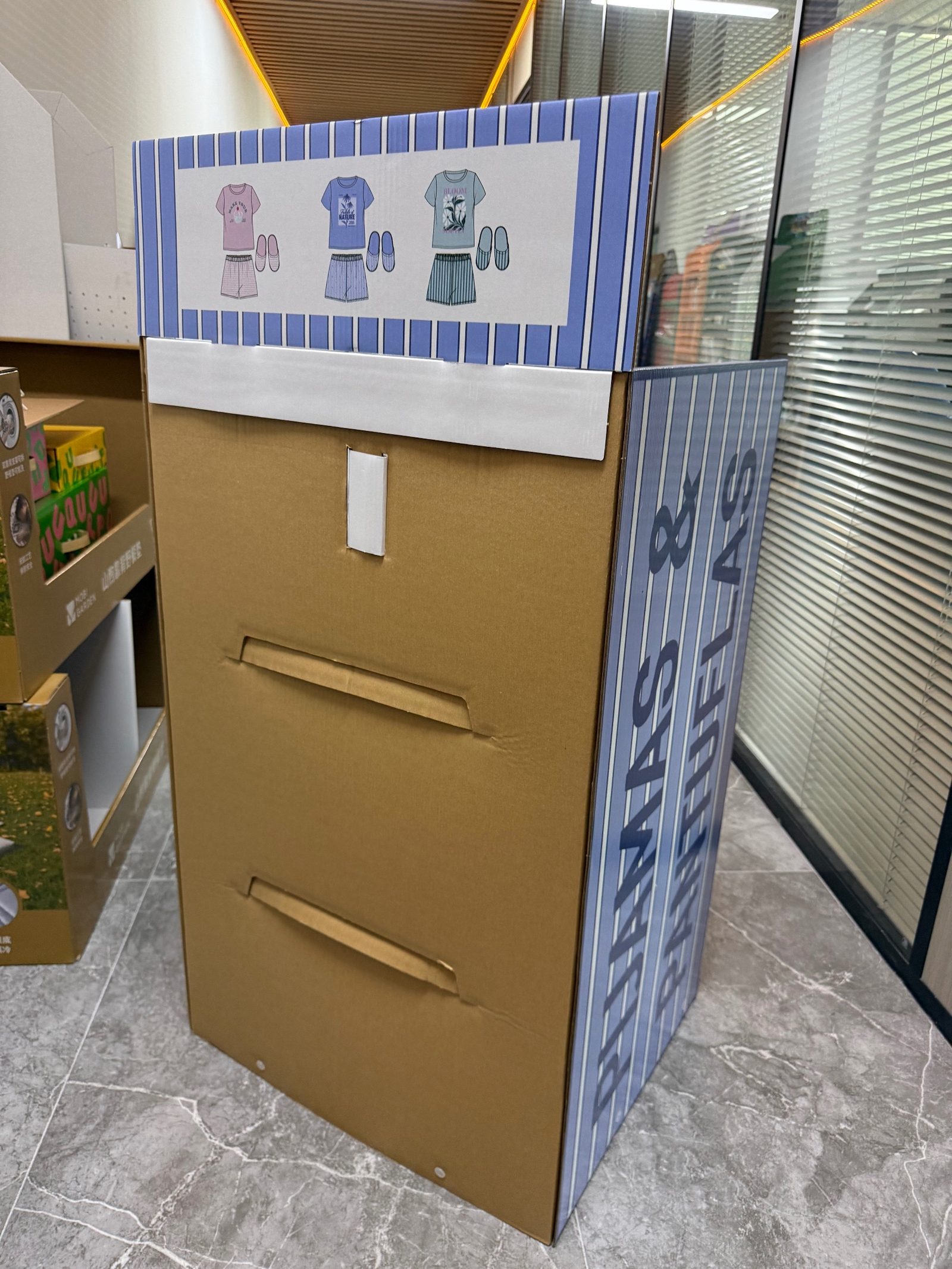Back panel of the floor display showing shelf support slots