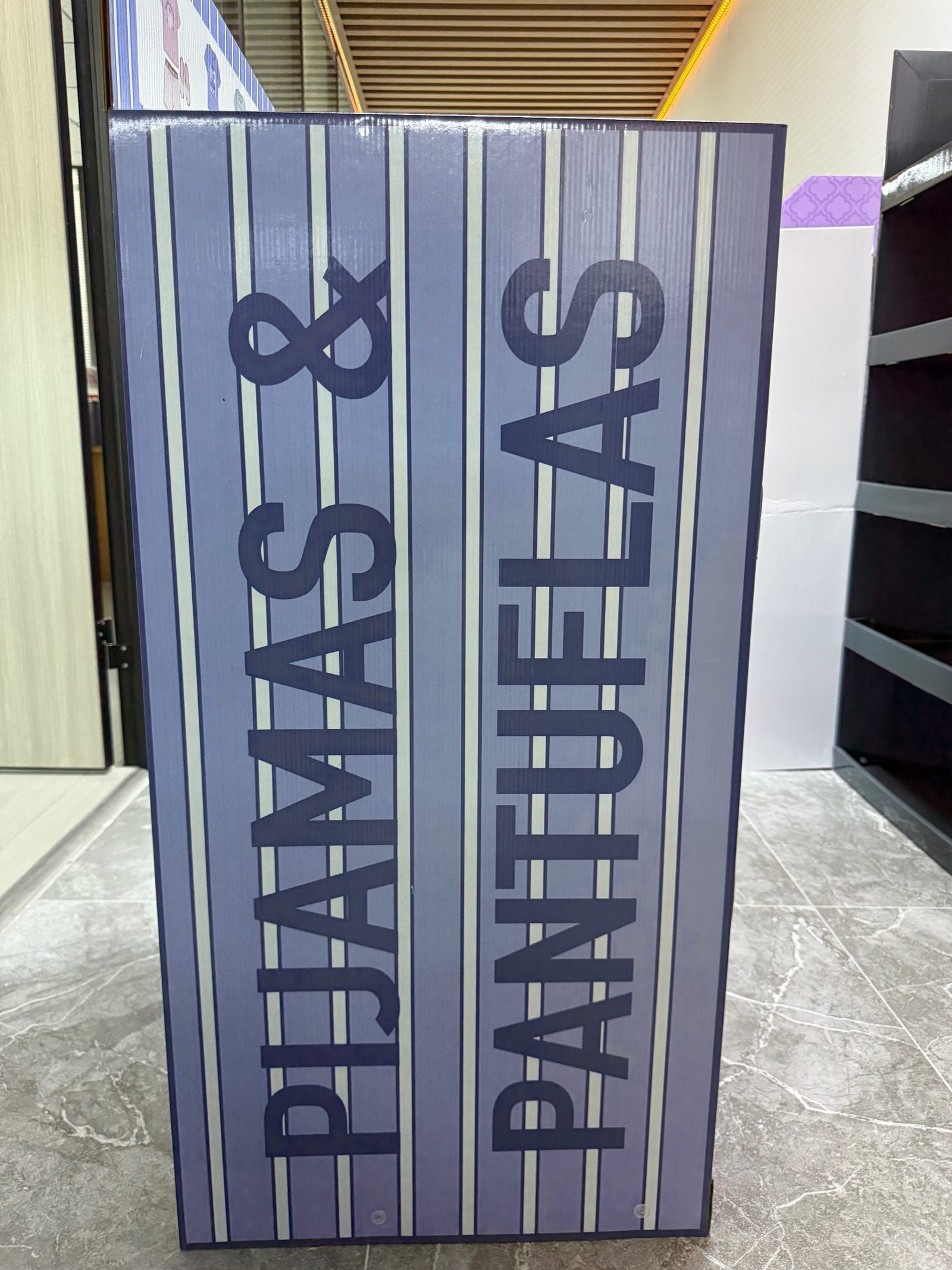 Side panel of corrugated pyjama and slipper floor display