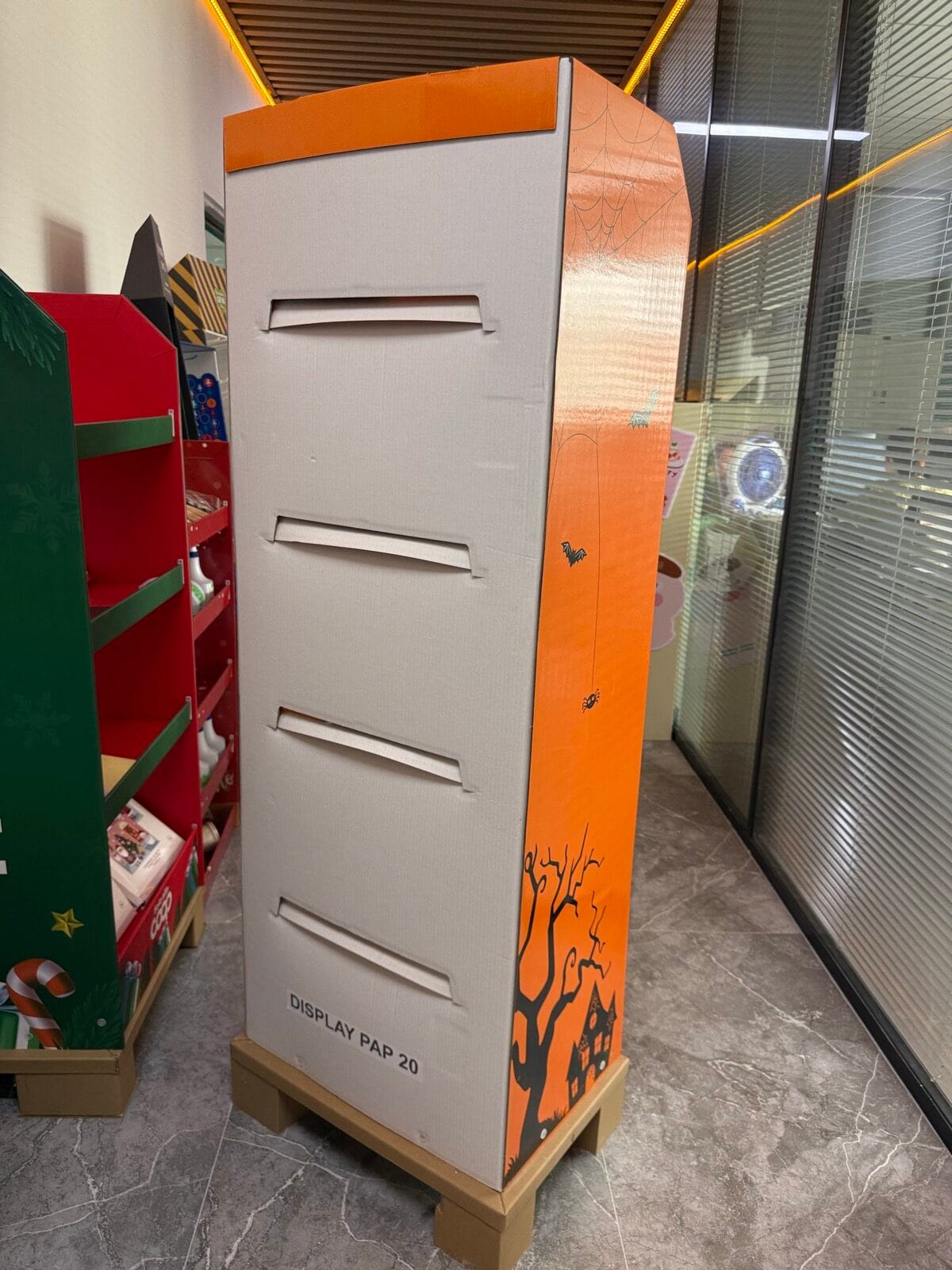 Rear view of the R003 corrugated floor display showing the back panel