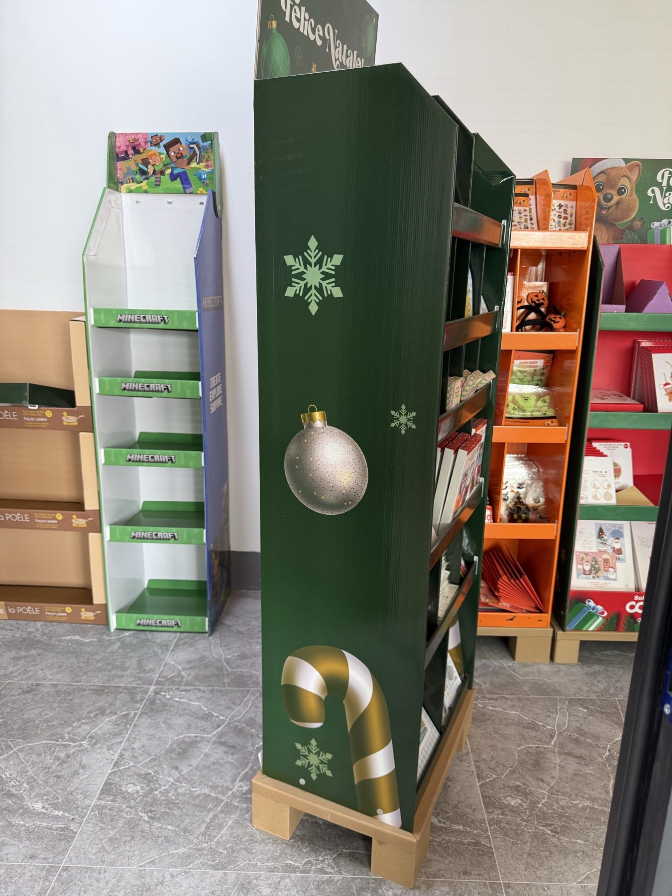 Side panel with Christmas ornaments on corrugated retail display