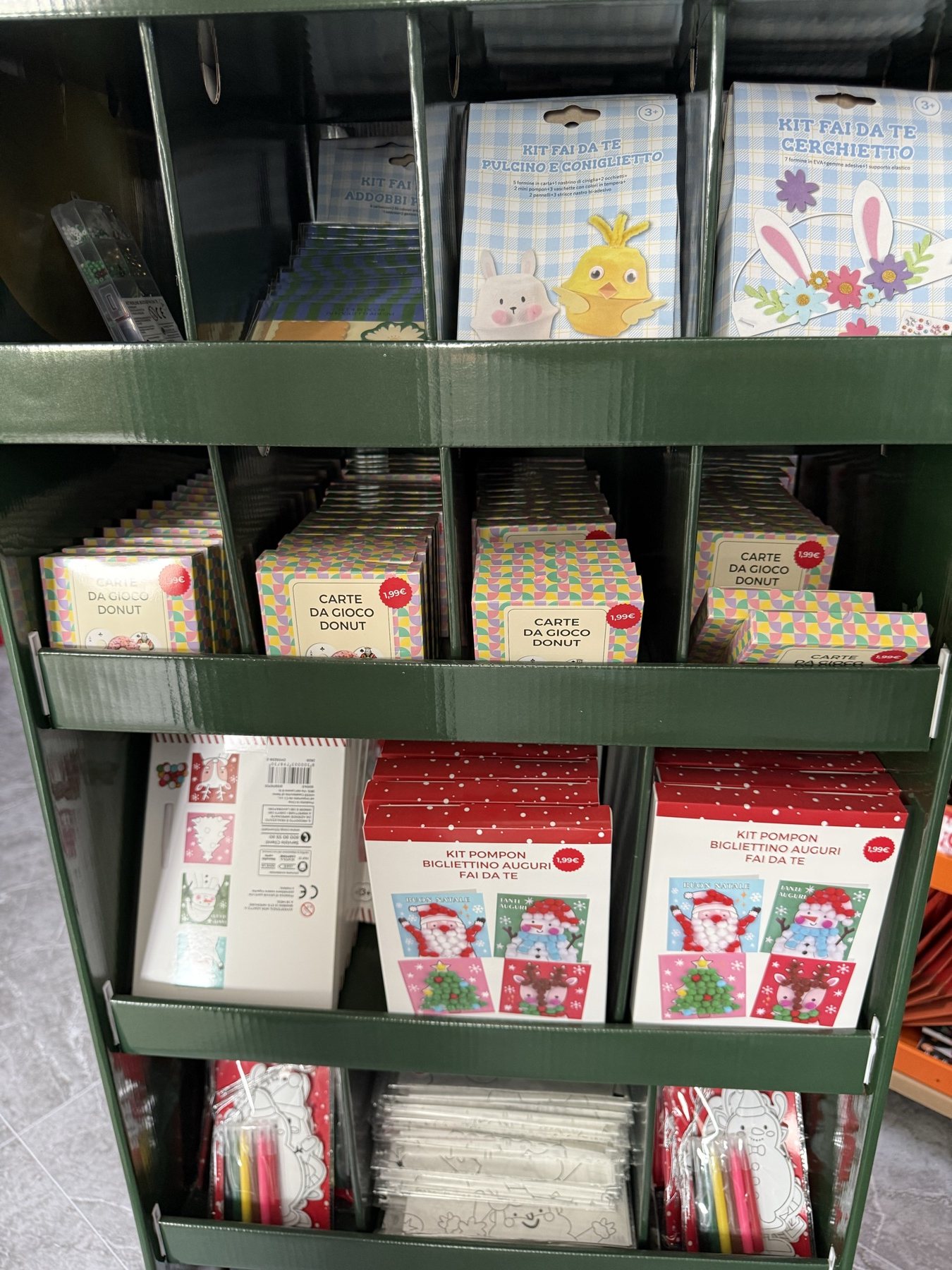 Multi-compartment shelves with Christmas cards and craft products