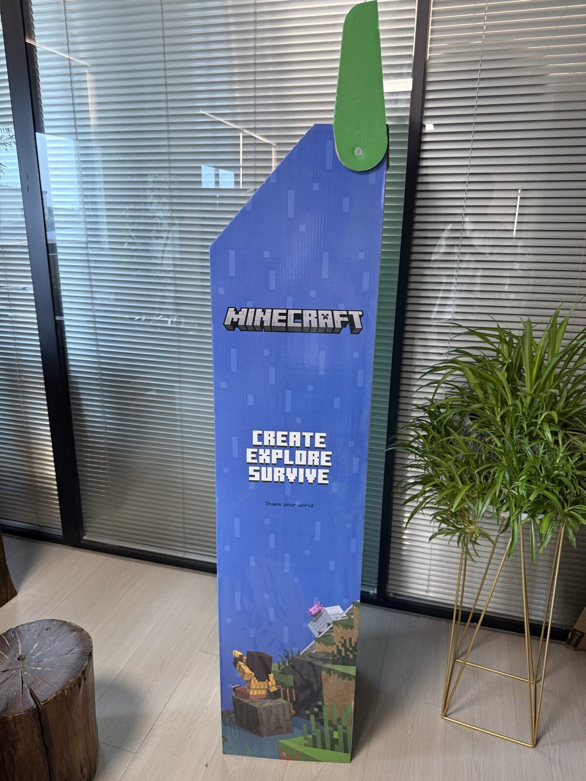 Blue printed side panel and header pivot of the corrugated gaming display