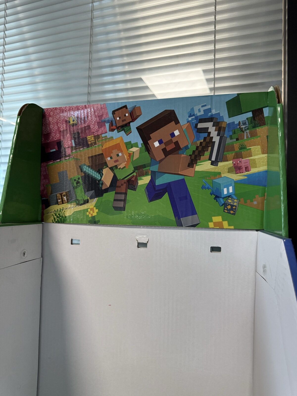 Close-up of the Game-themed printed header and retention openings